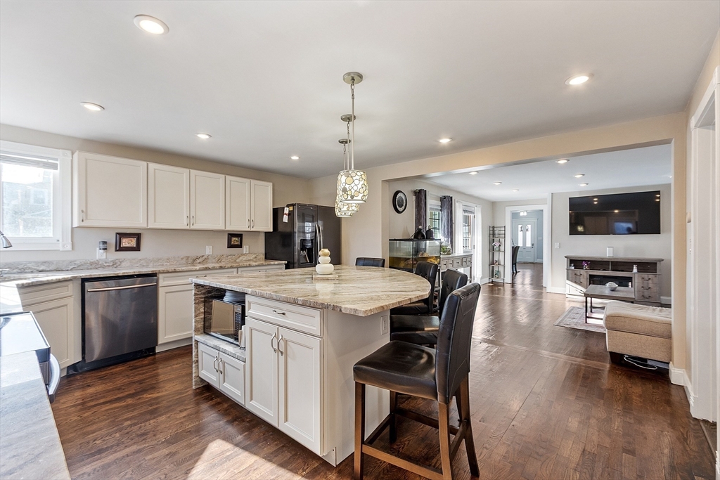 459 High Street Clinton, MA 01510 - Photo 13 of 35 a kitchen with a sink stove and cabinets