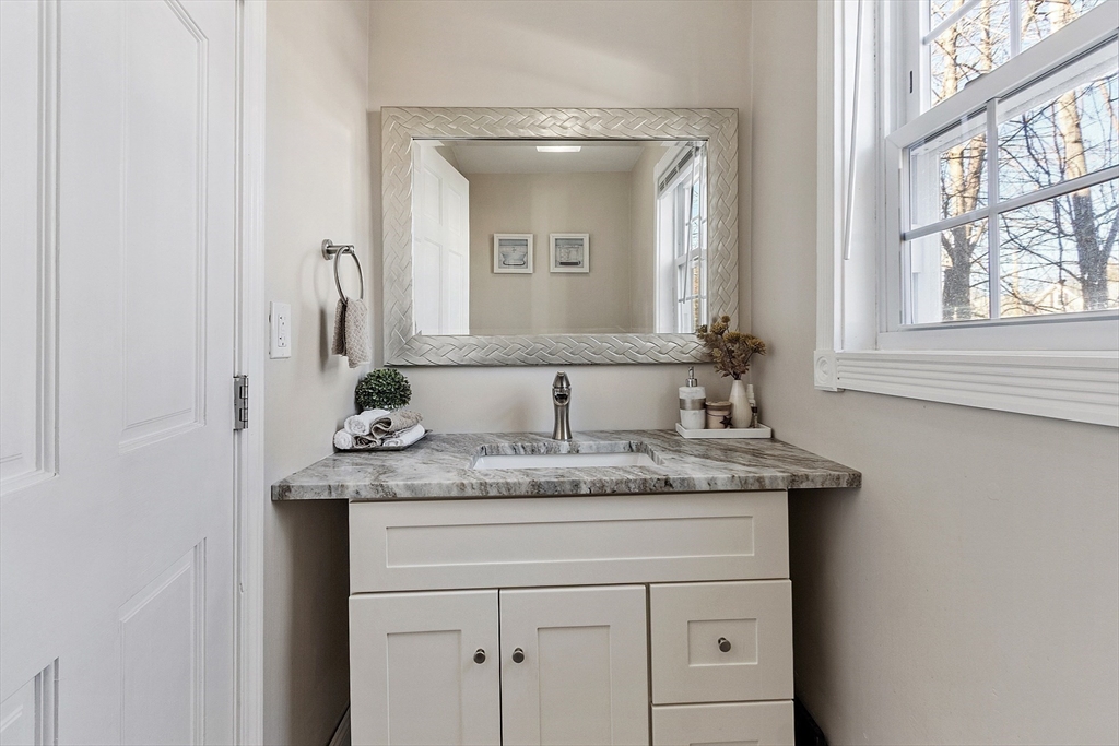 459 High Street Clinton, MA 01510 - Photo 14 of 35 a bathroom with a granite countertop sink and a mirror