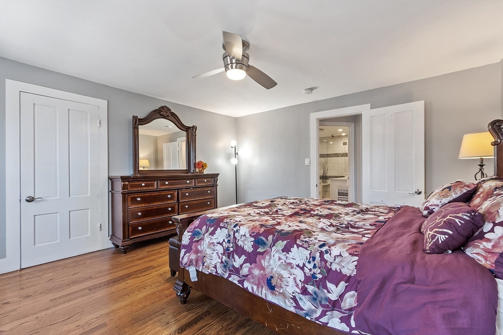 459 High Street Clinton, MA 01510 - Photo 17 of 35 a bedroom with a bed and wooden floor