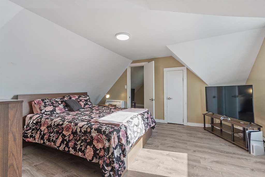 459 High Street Clinton, MA 01510 - Photo 18 of 35 a bedroom with double bed and a flat screen tv