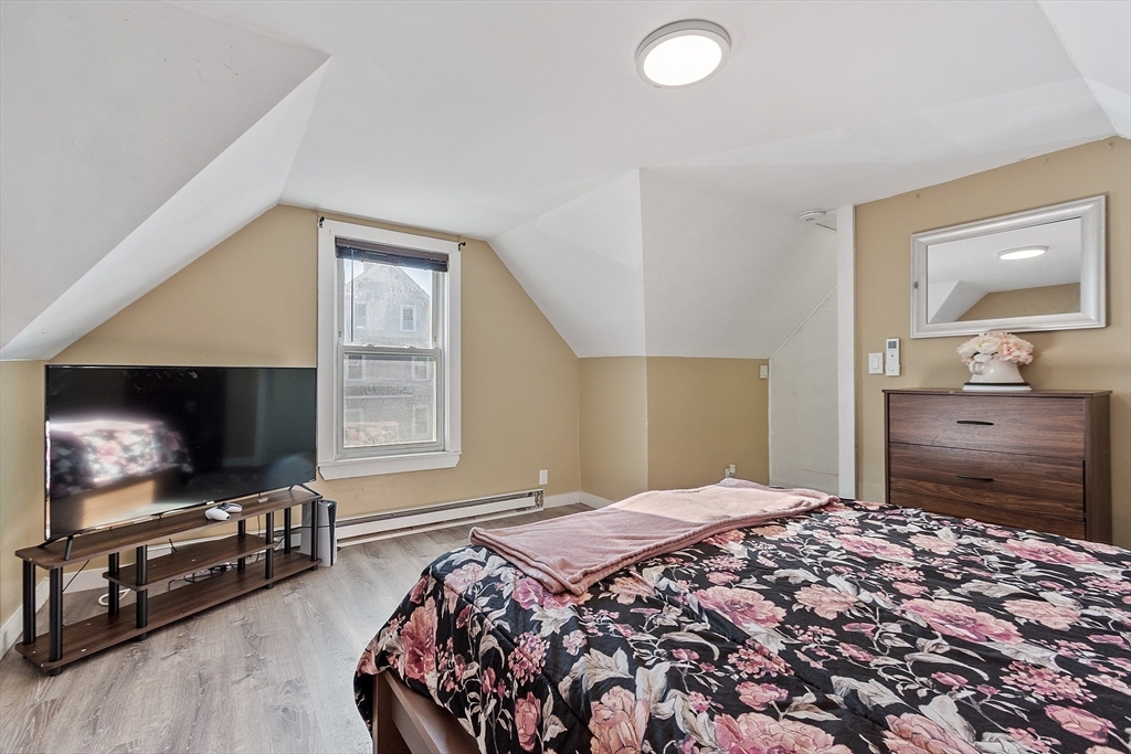 459 High Street Clinton, MA 01510 - Photo 19 of 35 a bedroom with a bed and a flat screen tv