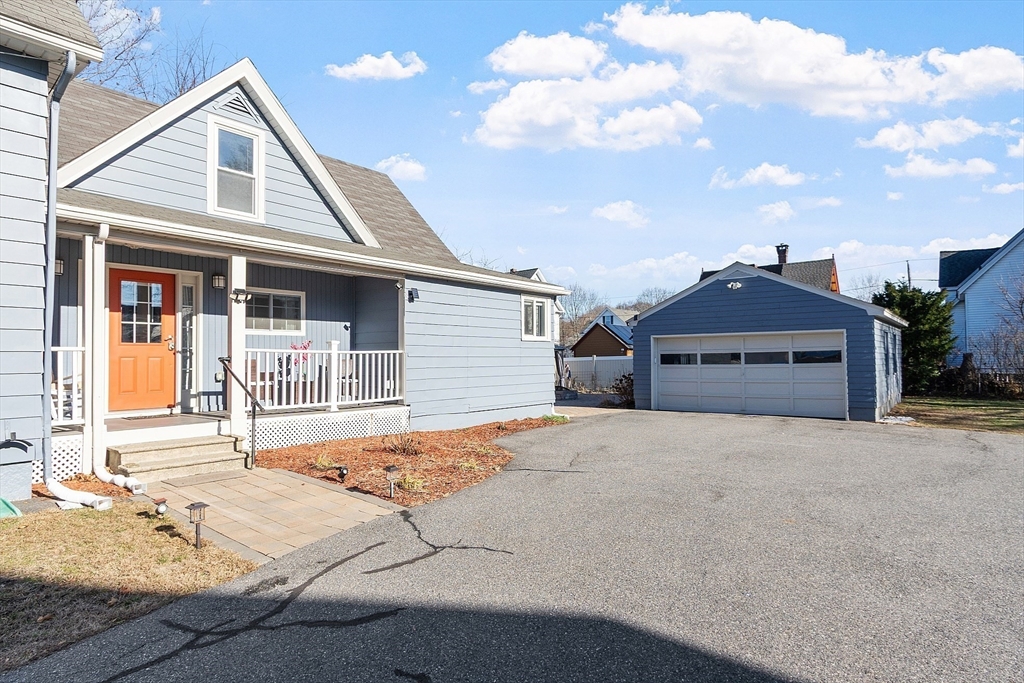 459 High Street Clinton, MA 01510 - Photo 27 of 35 a front view of a house with garden