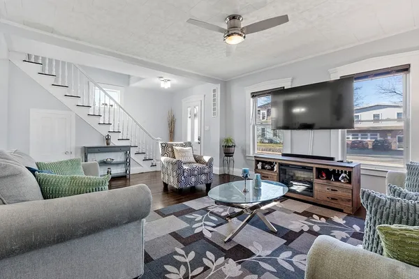 a living room with furniture and a flat screen tv