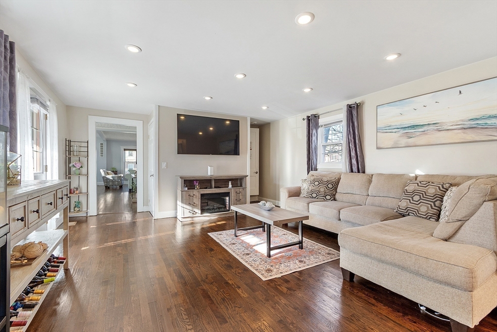 459 High Street Clinton, MA 01510 - Photo 8 of 35 a living room with furniture a fireplace and a flat screen tv
