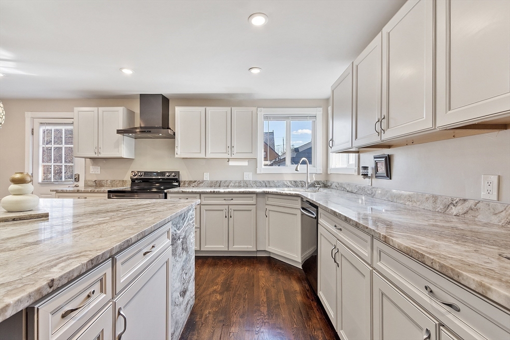 459 High Street Clinton, MA 01510 - Photo 10 of 35 a kitchen with kitchen island granite countertop a sink cabinets stainless steel appliances and a counter space