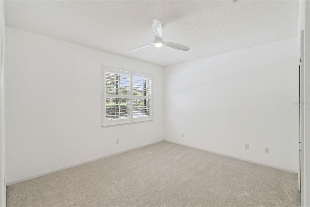 2230 Ridgewind Way Windermere, FL 34786 - Photo 22 of 38 an empty room with a empty space and windows