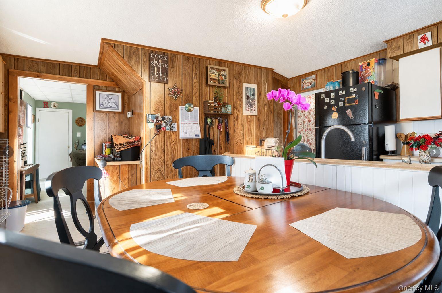 185 Rock Ridge Avenue Monticello, NY 12701 - Photo 4 of 6 a dining room with table and chairs