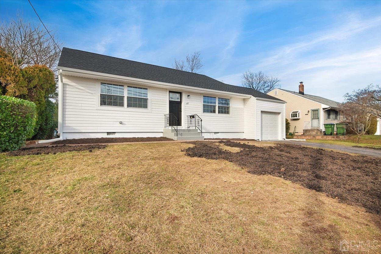 47 Eardley Road Edison, NJ 08817 - Photo 1 of 29 a house with trees in the background