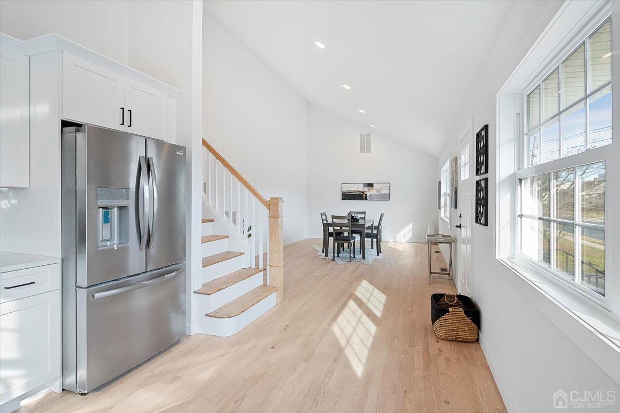 47 Eardley Road Edison, NJ 08817 - Photo 13 of 29 a kitchen with stainless steel appliances refrigerator and wooden floor