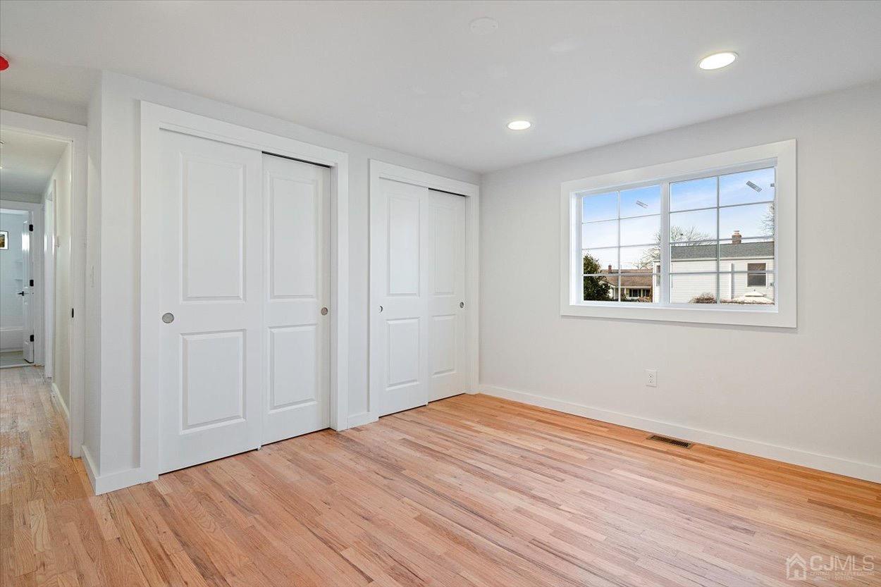 47 Eardley Road Edison, NJ 08817 - Photo 19 of 29 a view of empty room with wooden floor and fan