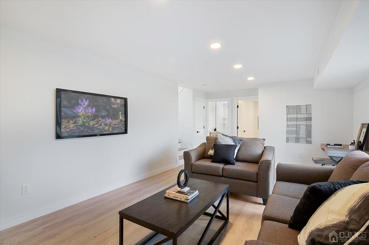 47 Eardley Road Edison, NJ 08817 - Photo 4 of 29 a living room with furniture and a wooden floor