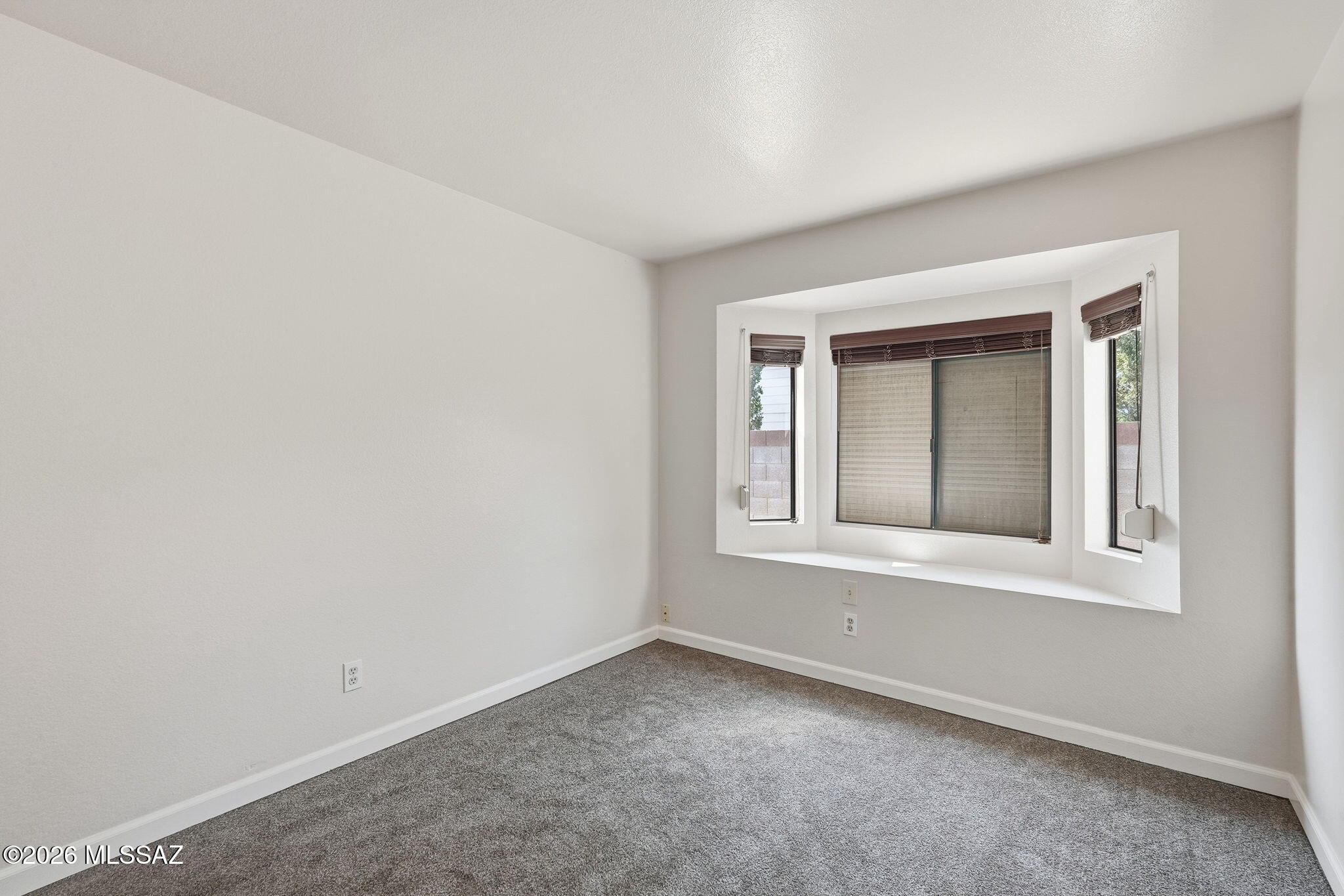5791 North Moonbrook Road Tucson, AZ 85741 - Photo 23 of 40 Bedroom 2 with Bay Window & Carpet