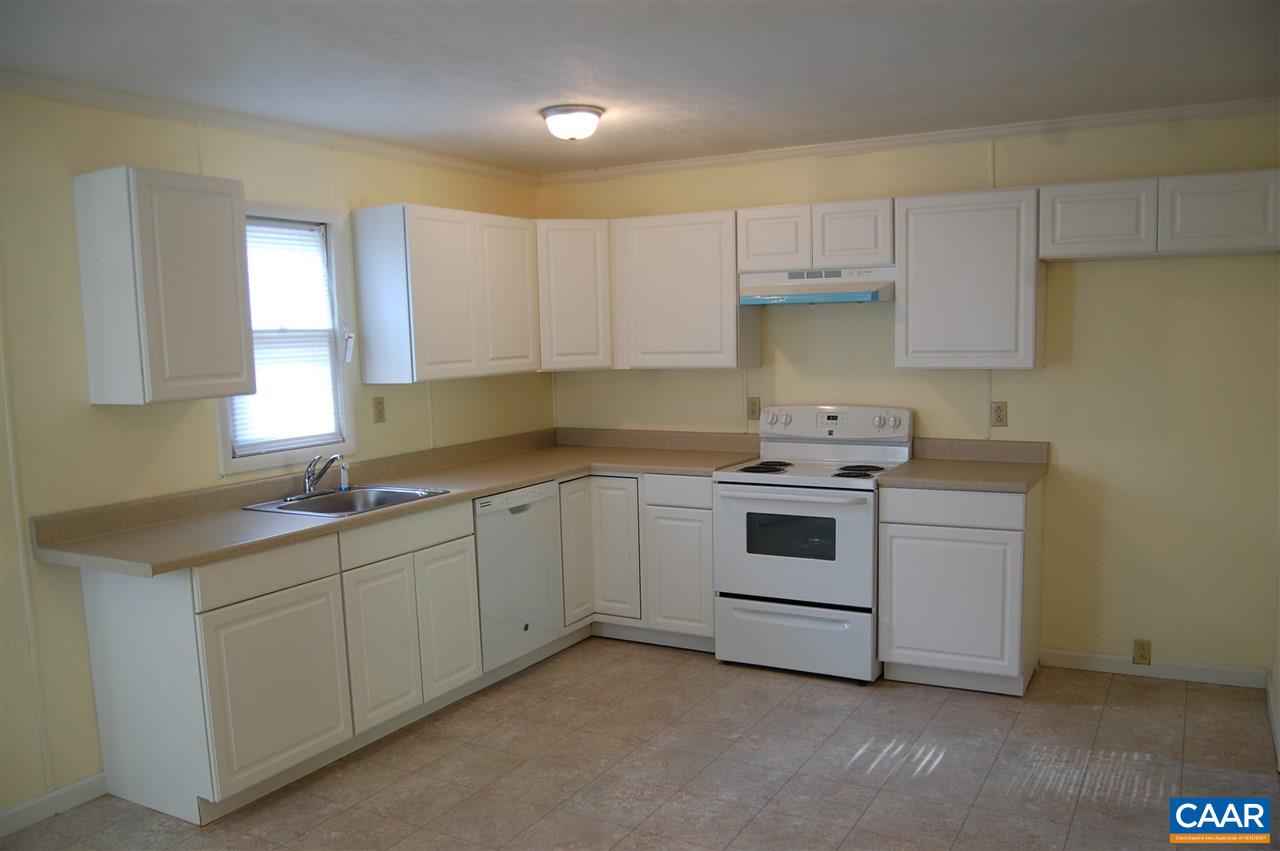 960 Axtell Road Howardsville, VA 24562 - Photo 8 of 18 a kitchen with cabinets appliances a sink and a window