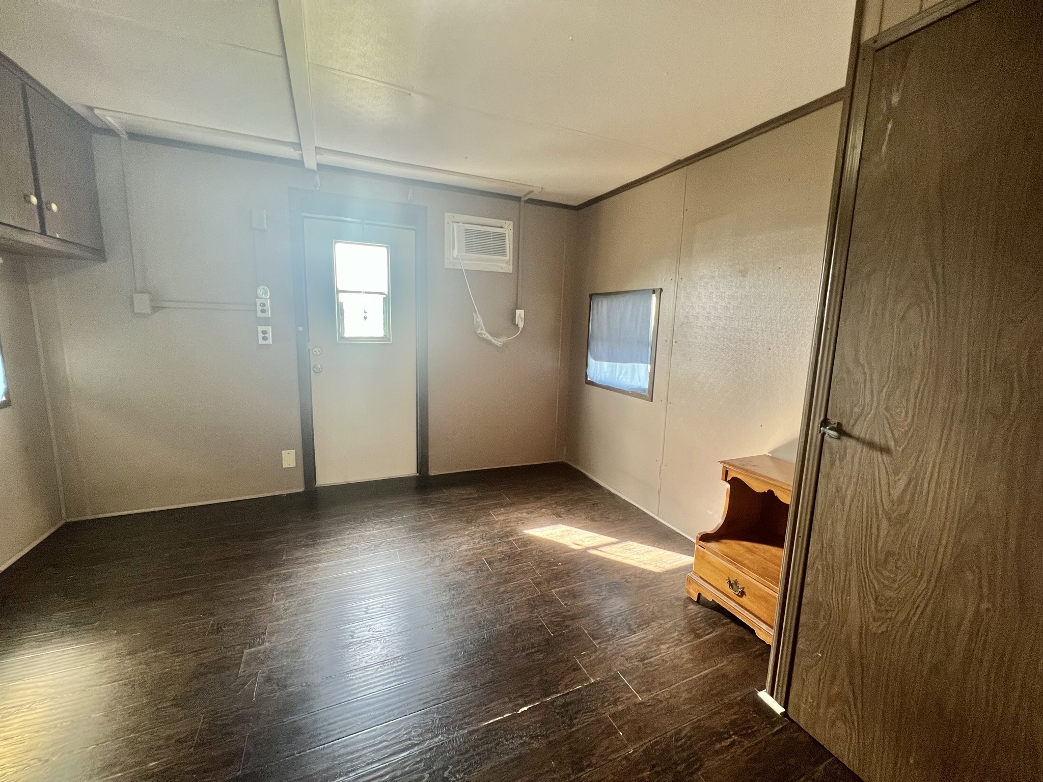 2749 Wagon Trail Road Pearland, TX 77584 - Photo 16 of 18 a view of an empty room with wooden floor and a window