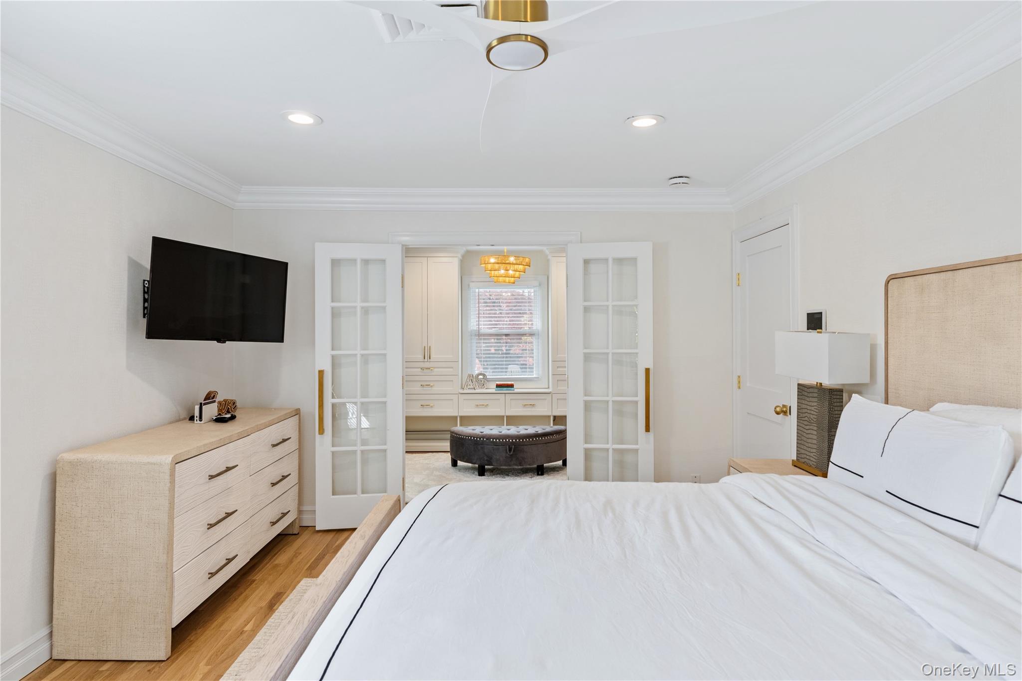 4 Long Ridge Road Plainview, NY 11803 - Photo 12 of 27 a bedroom with a bed and flat tv screen on the dresser