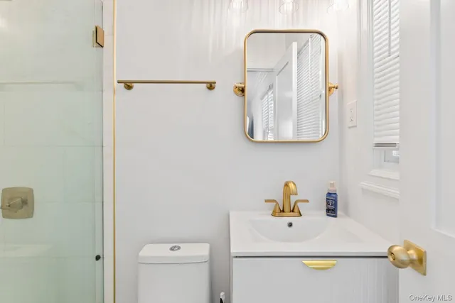 a bathroom with a sink and mirror