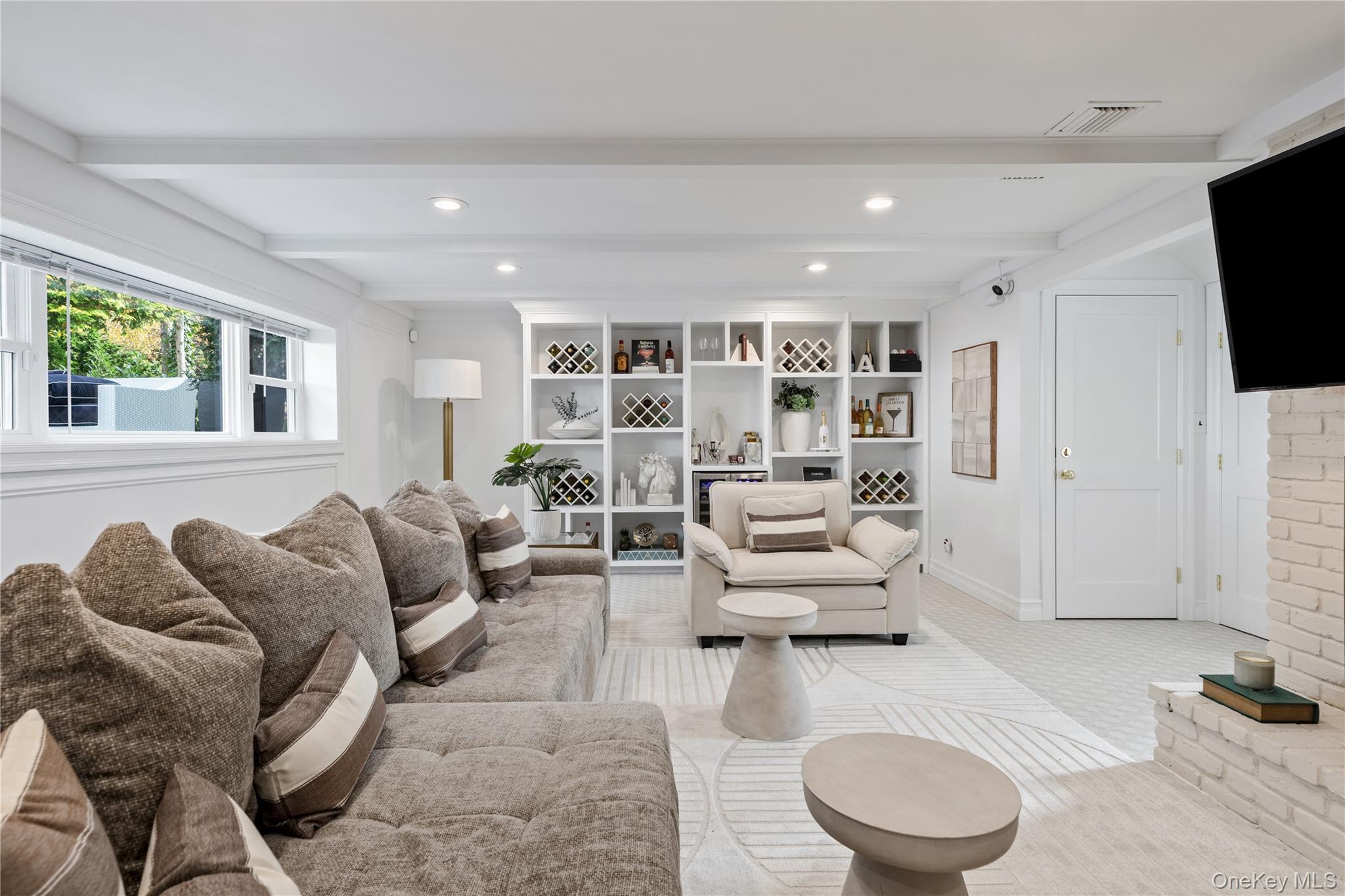 4 Long Ridge Road Plainview, NY 11803 - Photo 17 of 27 a living room with furniture and a flat screen tv