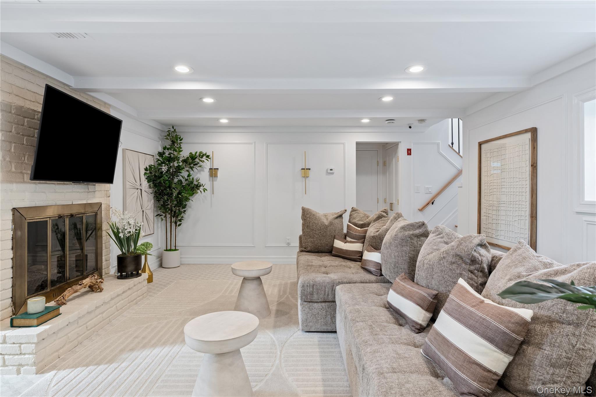 4 Long Ridge Road Plainview, NY 11803 - Photo 18 of 27 a living room with furniture a fireplace and a flat screen tv