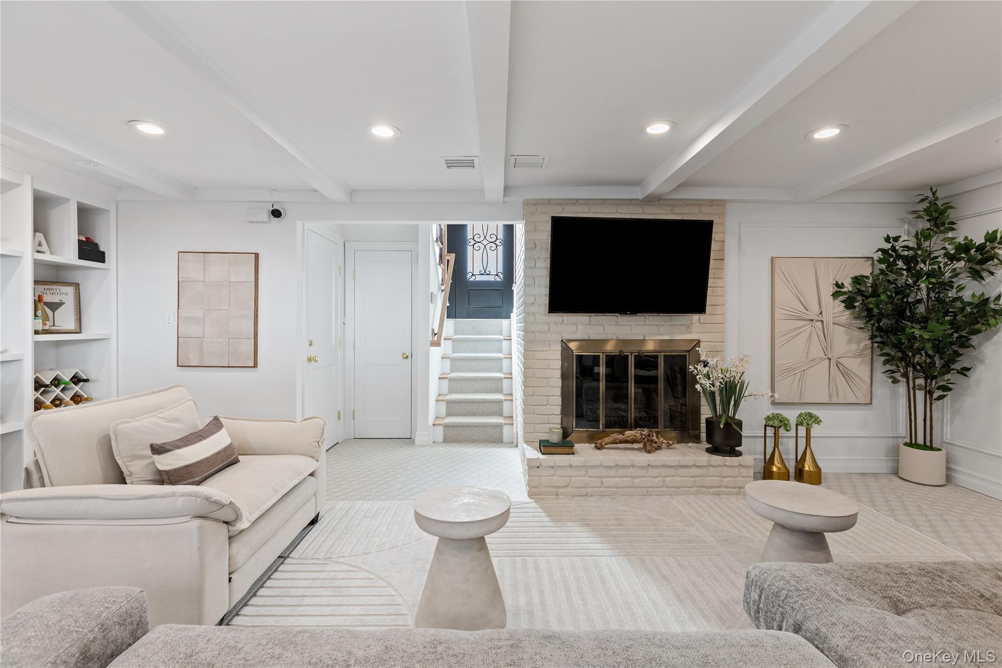 4 Long Ridge Road Plainview, NY 11803 - Photo 19 of 27 a living room with furniture a fireplace and a flat screen tv