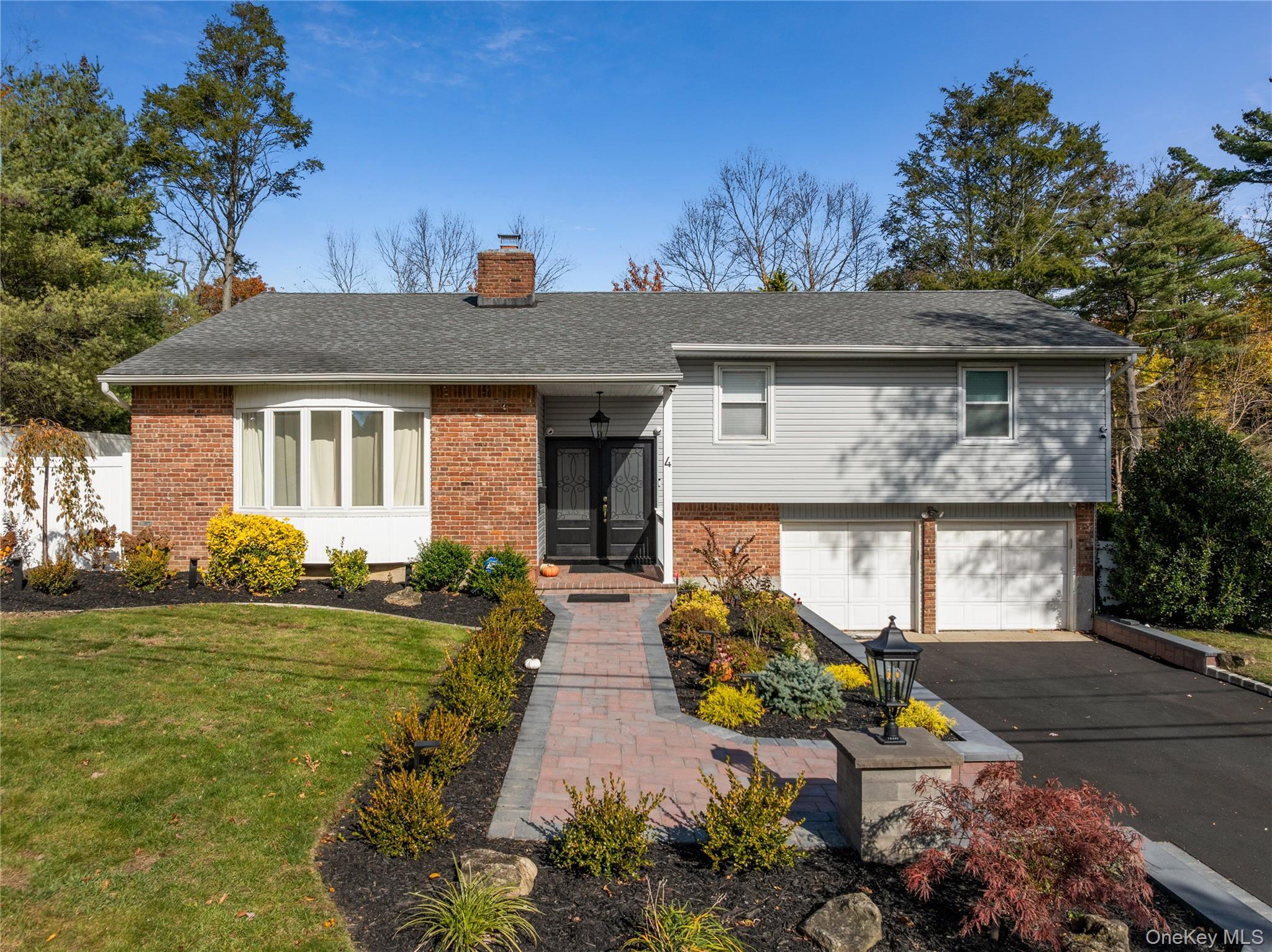 4 Long Ridge Road Plainview, NY 11803 - Photo 2 of 27 a front view of a house with garden