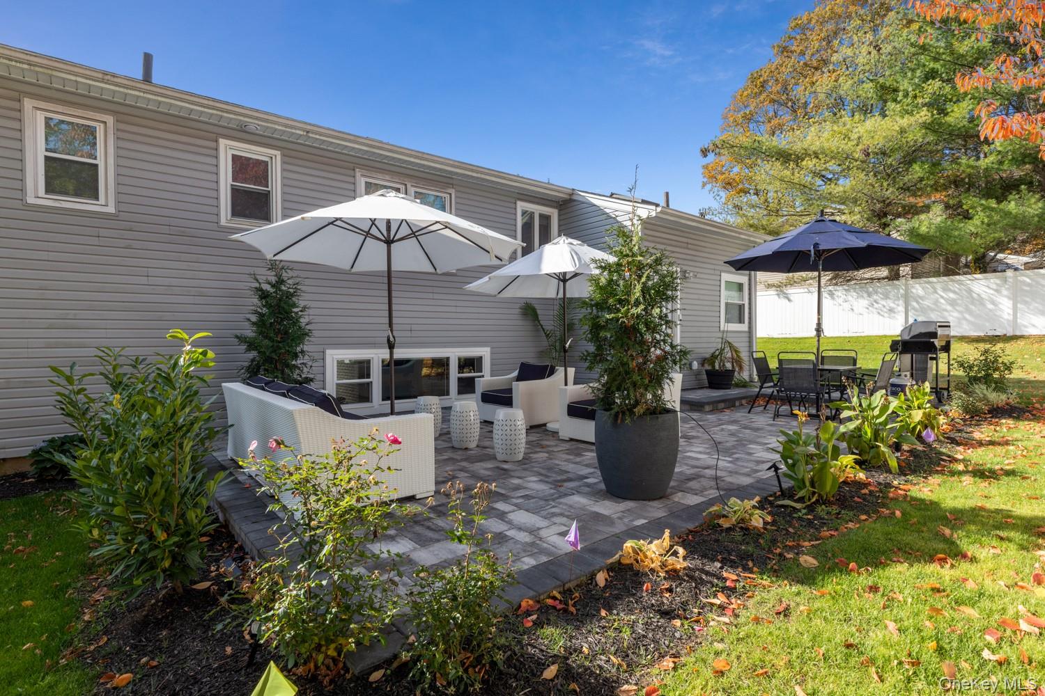4 Long Ridge Road Plainview, NY 11803 - Photo 21 of 27 a view of a patio with table and chairs potted plants
