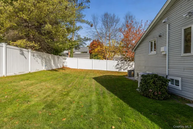 a view of a backyard with a tree