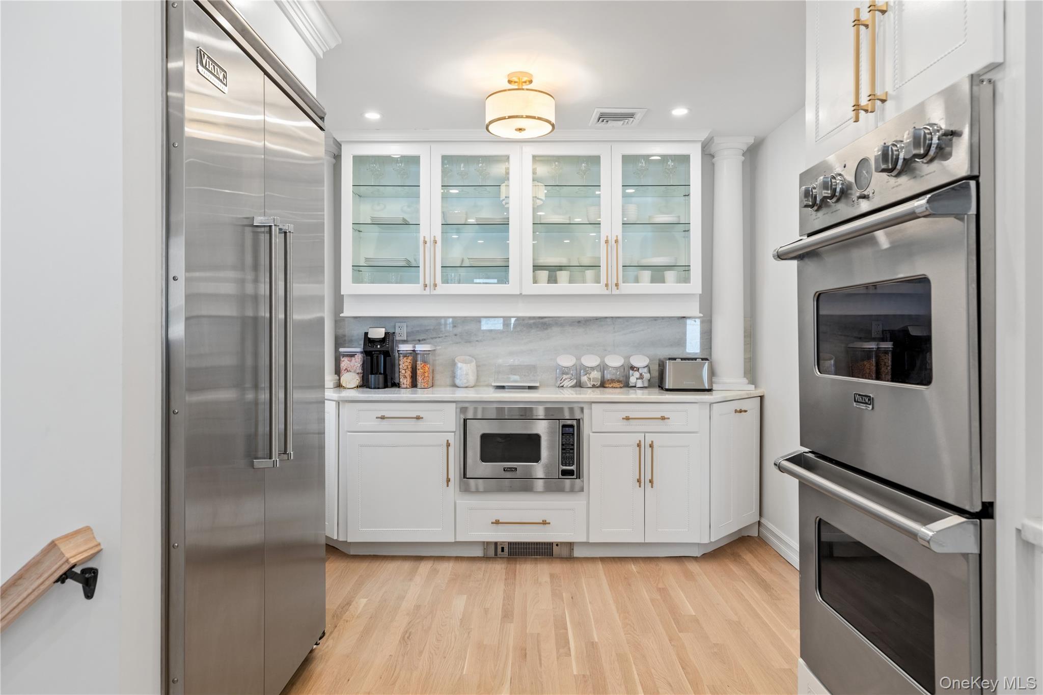 4 Long Ridge Road Plainview, NY 11803 - Photo 9 of 27 a kitchen with stainless steel appliances granite countertop a stove and a refrigerator