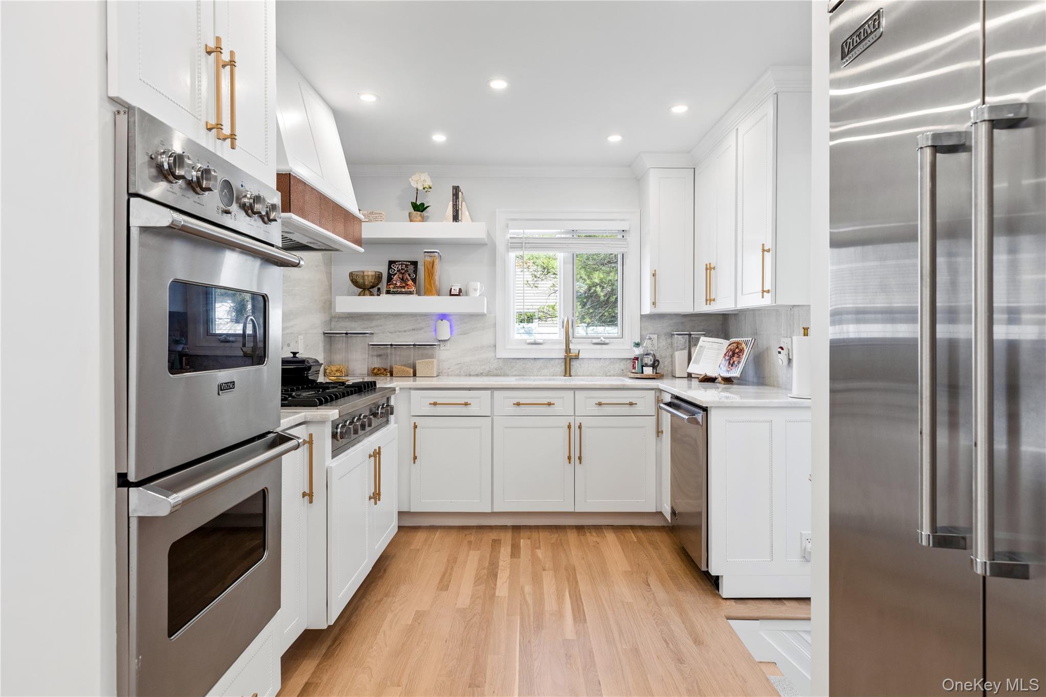 4 Long Ridge Road Plainview, NY 11803 - Photo 10 of 27 a kitchen with a sink stainless steel appliances and white cabinets