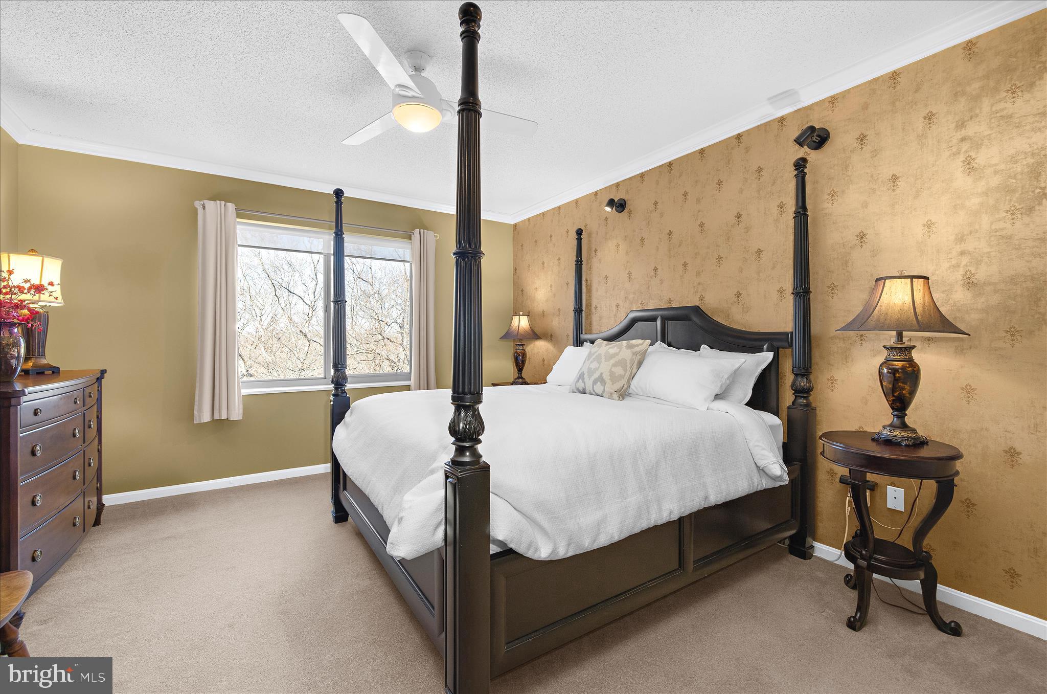 940 Astern Way, Unit 607 Annapolis, MD 21401 - Photo 17 of 45 a large bed sitting in a bedroom next to a window