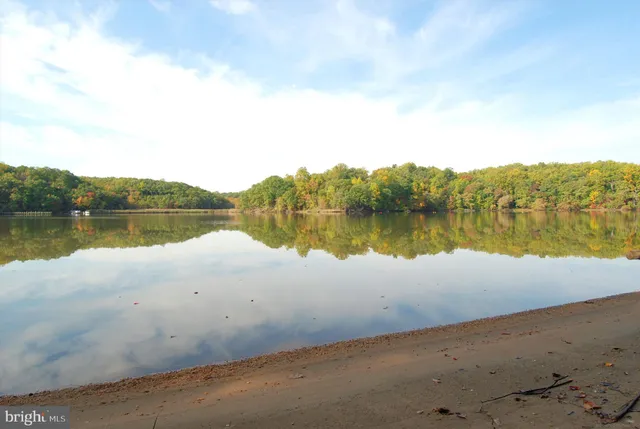 a view of wooden floor with a lake view