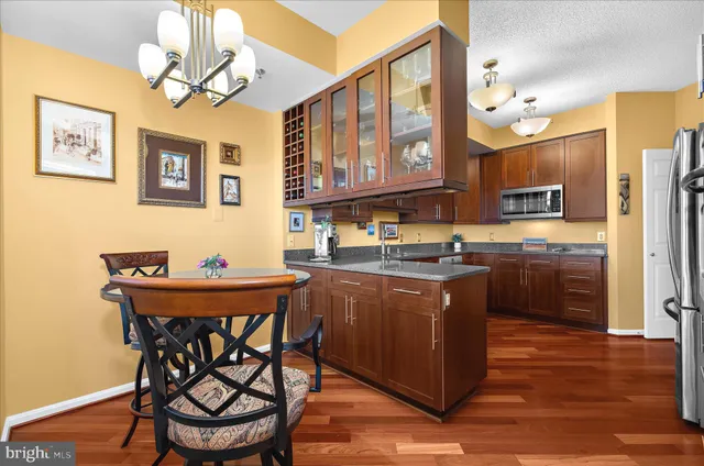 a kitchen with a stove a sink and a refrigerator