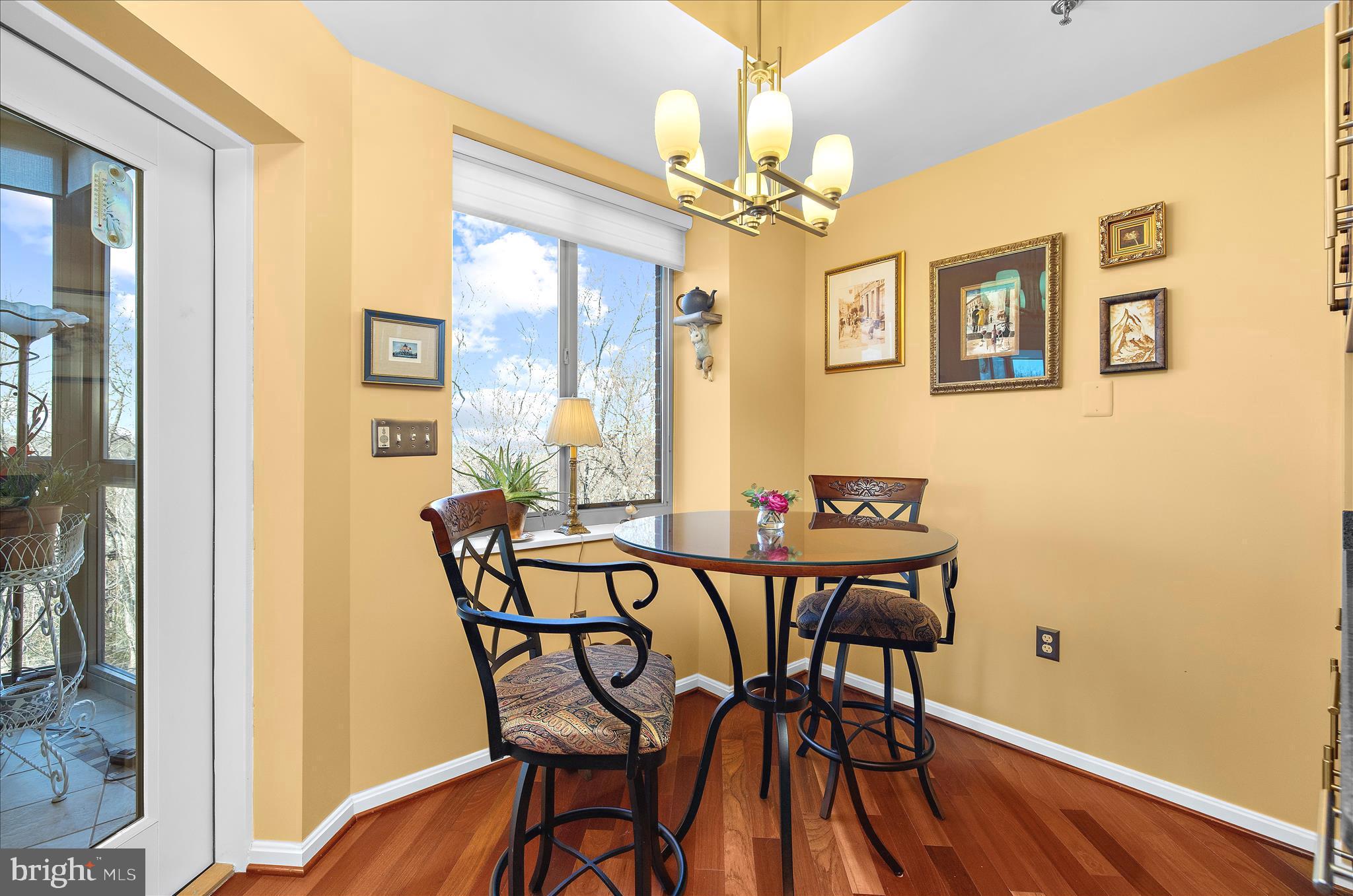 940 Astern Way, Unit 607 Annapolis, MD 21401 - Photo 6 of 45 a view of a dining room with furniture and chandelier