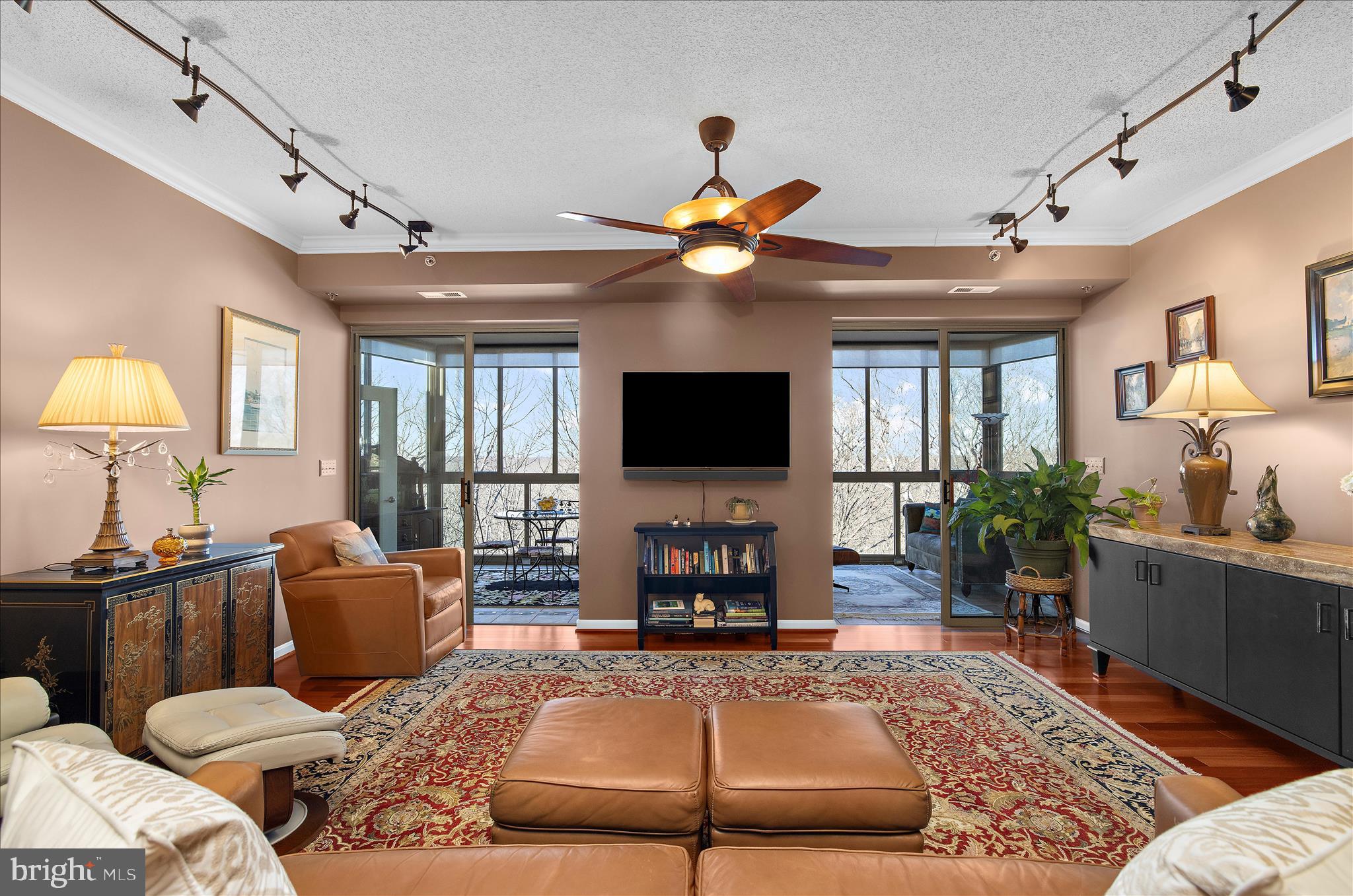 940 Astern Way, Unit 607 Annapolis, MD 21401 - Photo 9 of 45 a living room with furniture a flat screen tv and a chandelier
