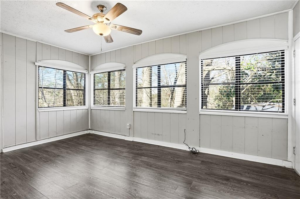 151 Elysian Way Northwest Atlanta, GA 30327 - Photo 14 of 31 a view of an empty room with wooden floor and a window