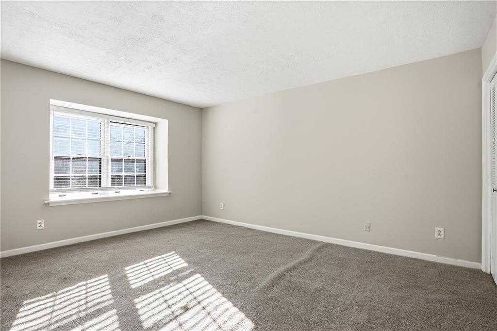 151 Elysian Way Northwest Atlanta, GA 30327 - Photo 15 of 31 a view of an empty room with a window