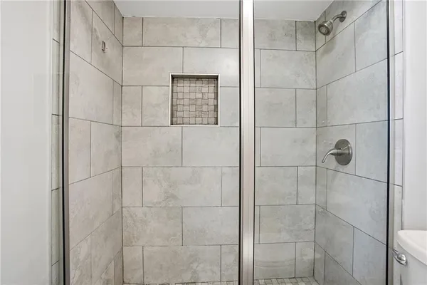 a bathroom with a double vanity sink mirror and toilet