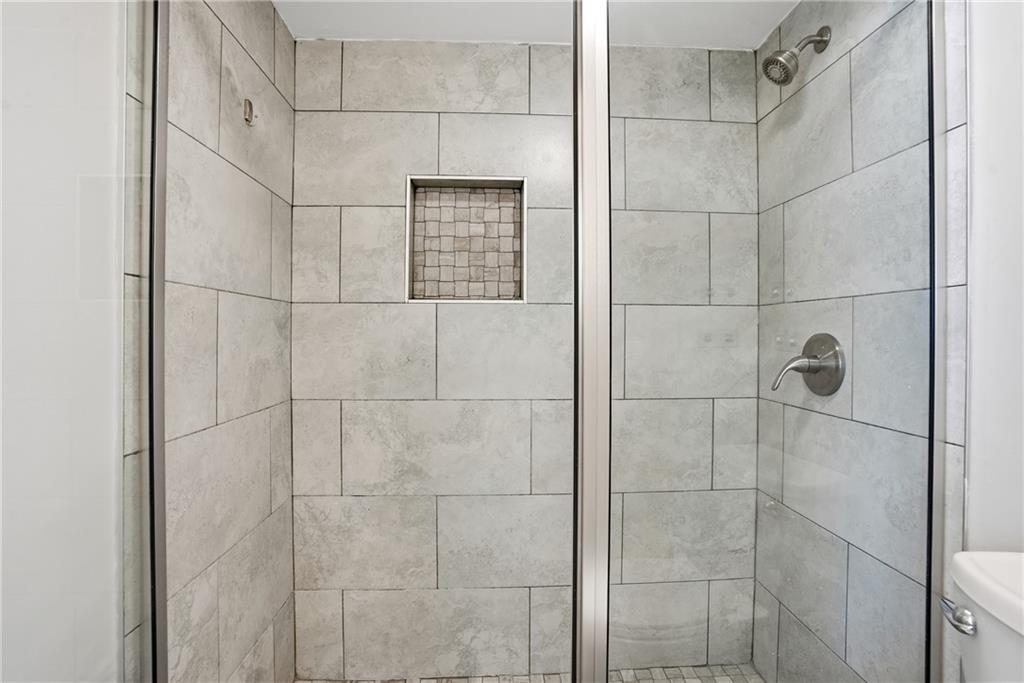 151 Elysian Way Northwest Atlanta, GA 30327 - Photo 20 of 31 a bathroom with a shower