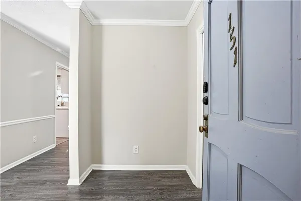 a view of front door with wooden floor