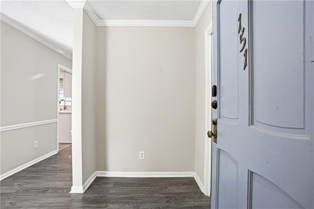 151 Elysian Way Northwest Atlanta, GA 30327 - Photo 2 of 31 a view of front door with wooden floor