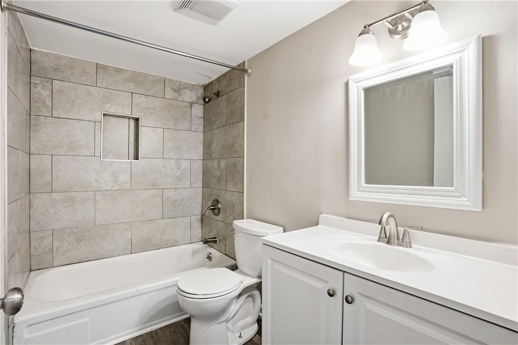 151 Elysian Way Northwest Atlanta, GA 30327 - Photo 24 of 31 a bathroom with a sink a toilet and shower