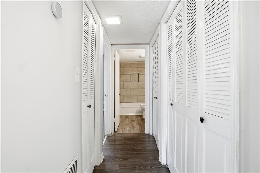 151 Elysian Way Northwest Atlanta, GA 30327 - Photo 25 of 31 a view of a hallway with wooden floor