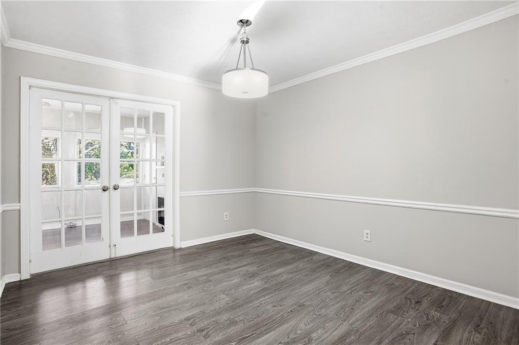 151 Elysian Way Northwest Atlanta, GA 30327 - Photo 7 of 31 a view of a room with wooden floor and windows