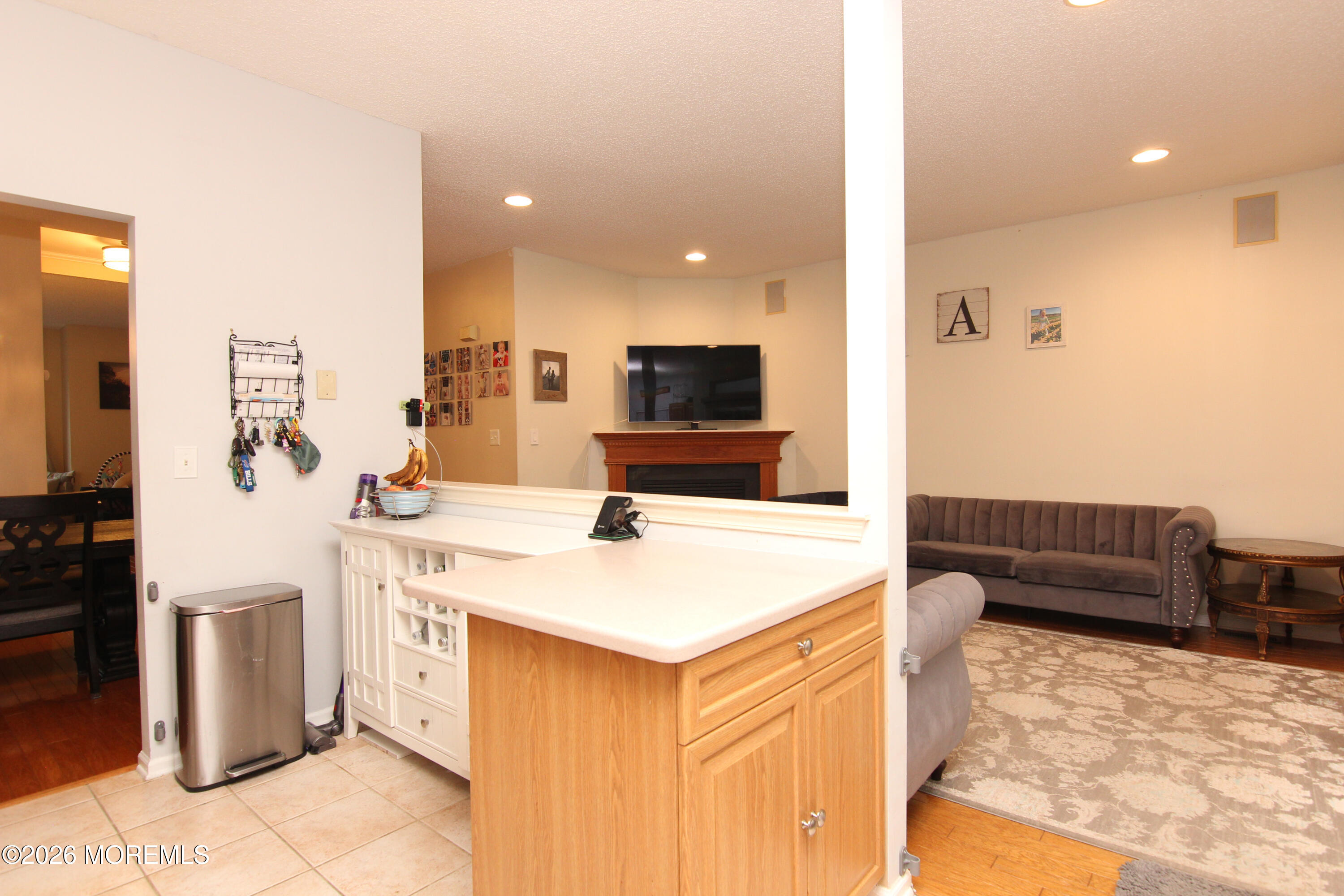 33 Austin Street Tinton Falls, NJ 07712 - Photo 40 of 46 a kitchen with stainless steel appliances kitchen island granite countertop a sink and a refrigerator