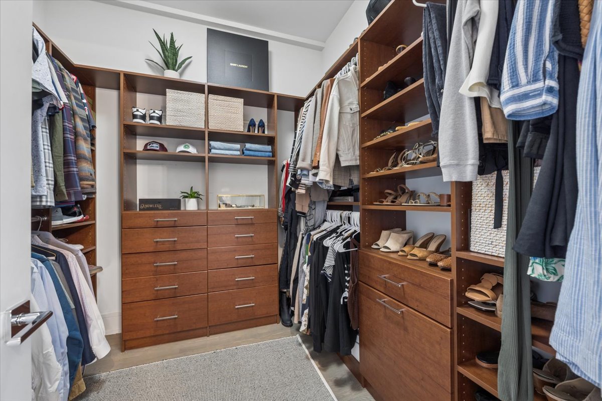 3518 West Wolfram Street, Unit 2 Chicago, IL 60618 - Photo 21 of 34 a view of walk in closet with clothes and shoes