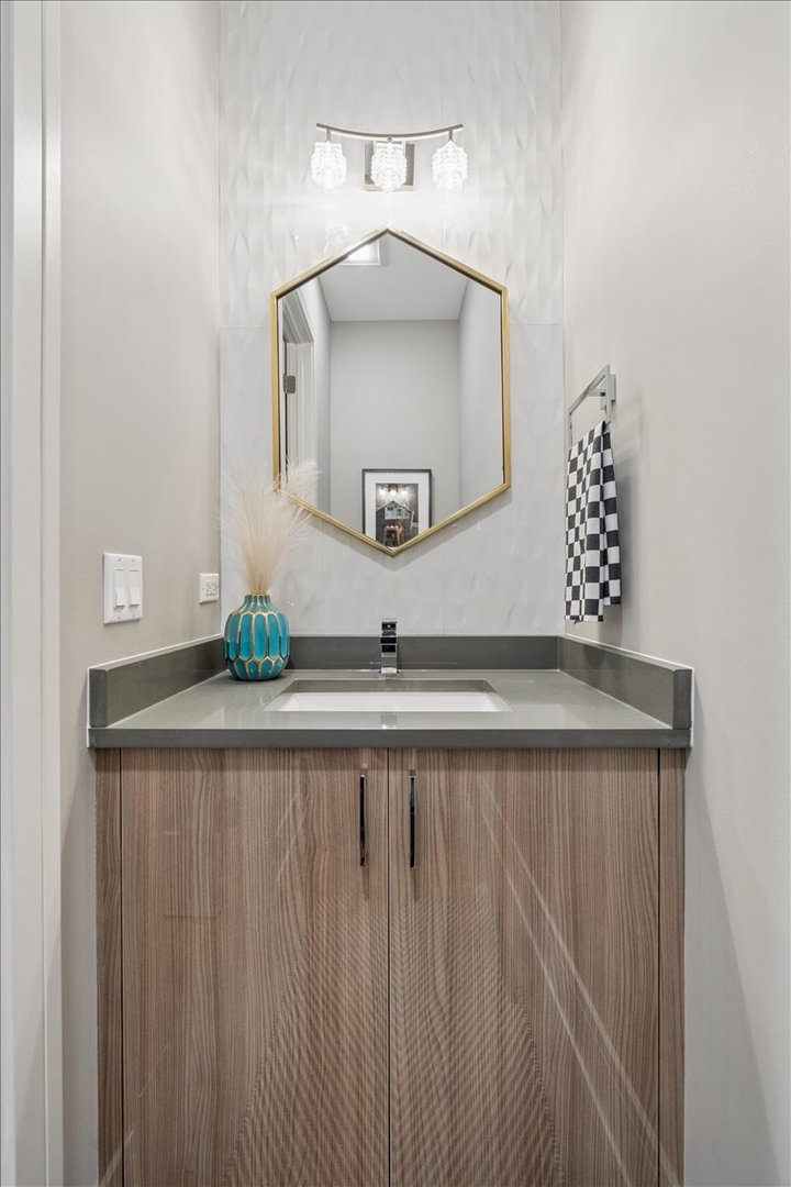 3518 West Wolfram Street, Unit 2 Chicago, IL 60618 - Photo 26 of 34 a bathroom with a sink a mirror and vanity