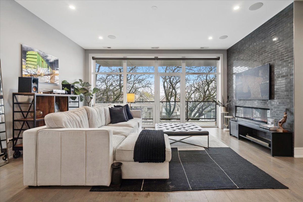 3518 West Wolfram Street, Unit 2 Chicago, IL 60618 - Photo 3 of 34 a living room with furniture and a large window