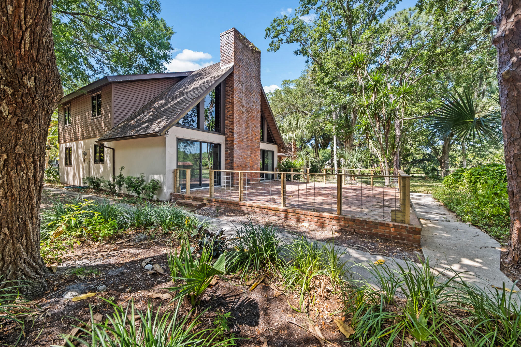 5115 Ranchland Road Melbourne, FL 32934 - Photo 1 of 31 a view of a house with a small yard