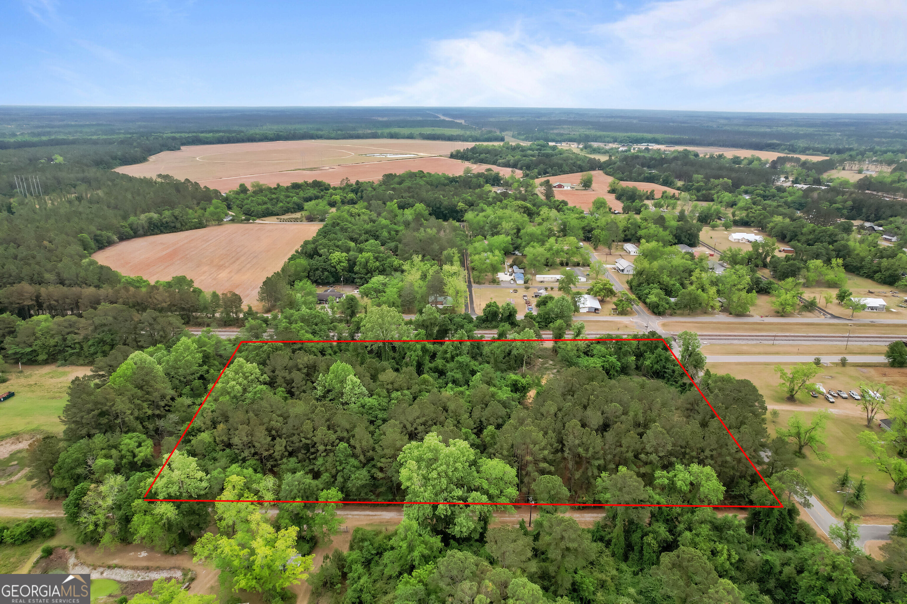 0 Offerman Loop Patterson, GA 31557 - Photo 8 of 16 an aerial view of green landscape with trees houses and lake view