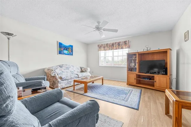 a living room with furniture and a rug
