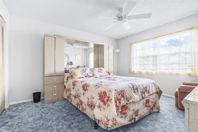 a view of swimming pool with a patio